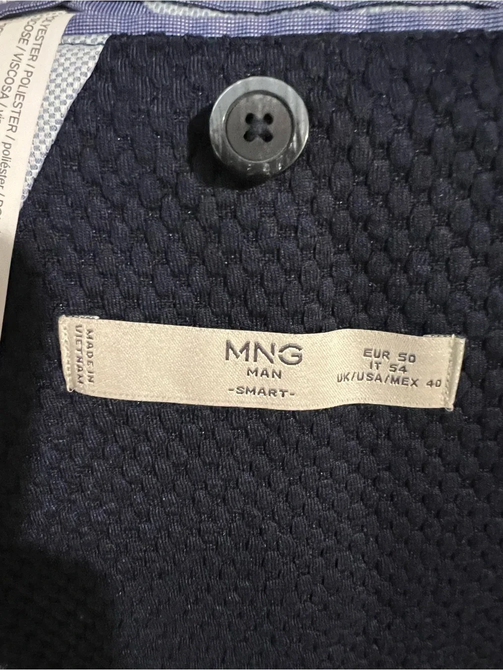 MANGO Man navy blazer features a textured microstructure fabric